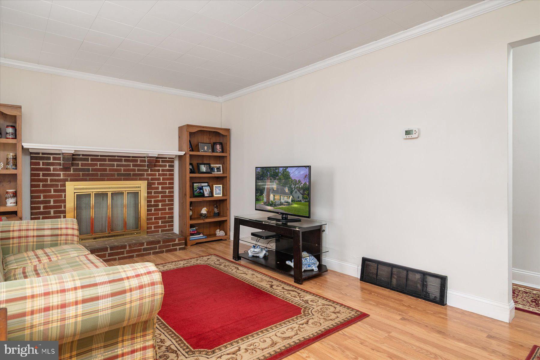 19 Old Tollgate Road Owings Mills, MD 21117 - Photo 4 of 37 a living room with furniture gym equipment and a flat screen tv