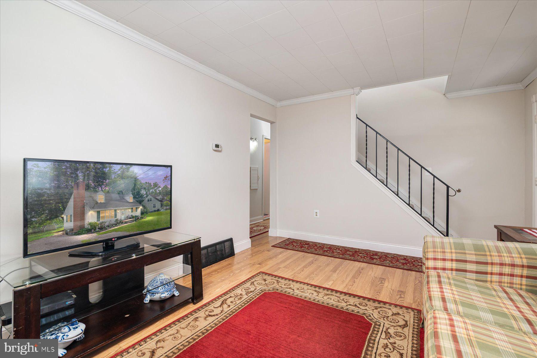 19 Old Tollgate Road Owings Mills, MD 21117 - Photo 6 of 37 a living room with furniture and a flat screen tv