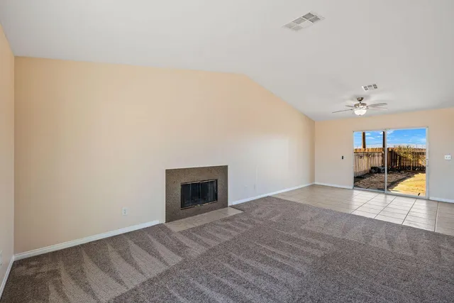 a kitchen with stainless steel appliances granite countertop a stove microwave and cabinets