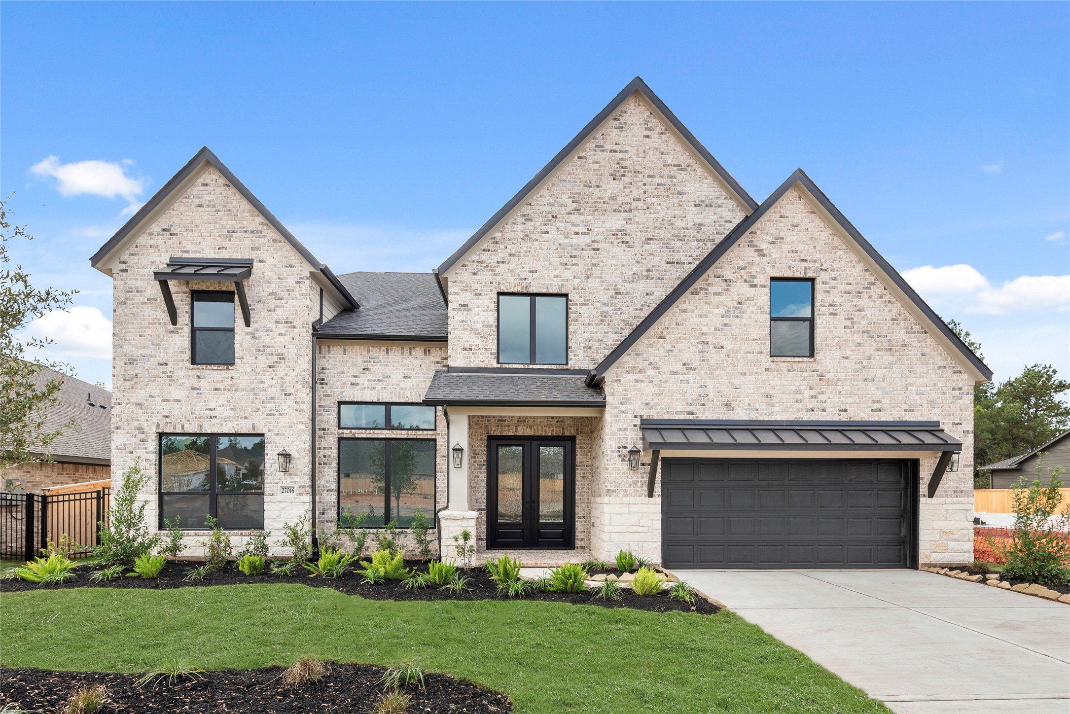 Move in Ready. Westin Homes *New Construction* Carter XL Plan. Grass is digitally enhanced.