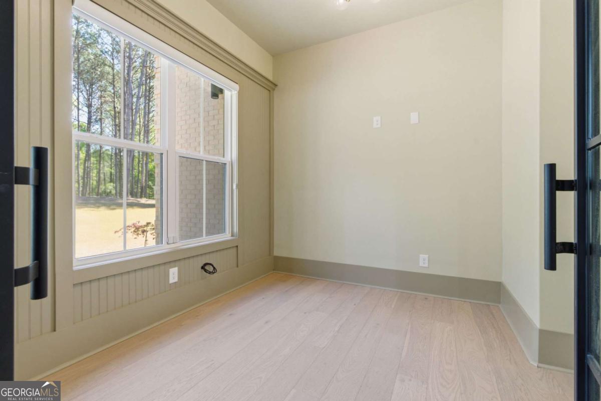 1315 Sandy Creek Road Tyrone, GA 30290 - Photo 70 of 100 an empty room with a window