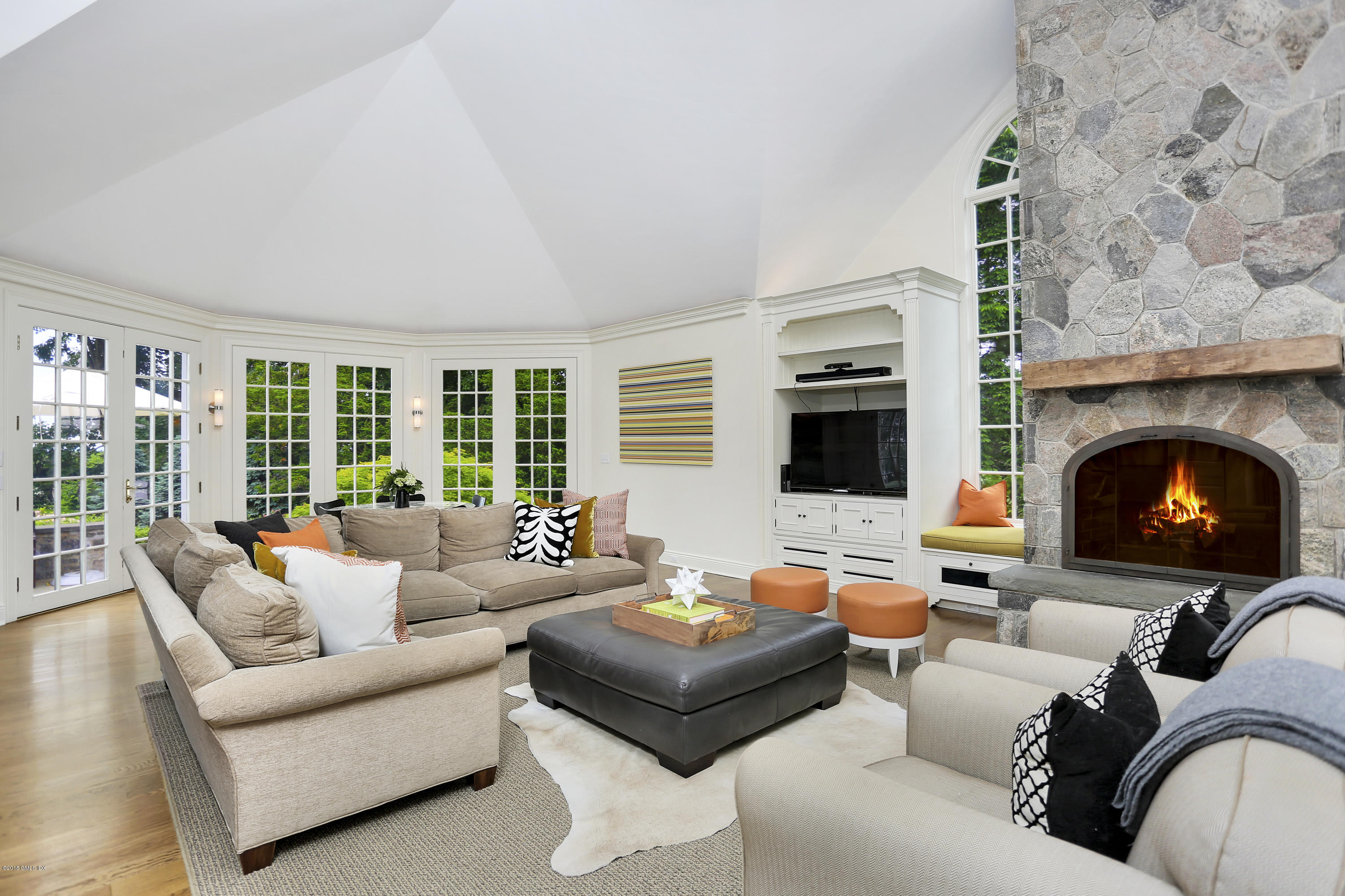 5 Dairy Road Greenwich, CT 06830 - Photo 11 of 32 a living room with furniture large window and a fireplace