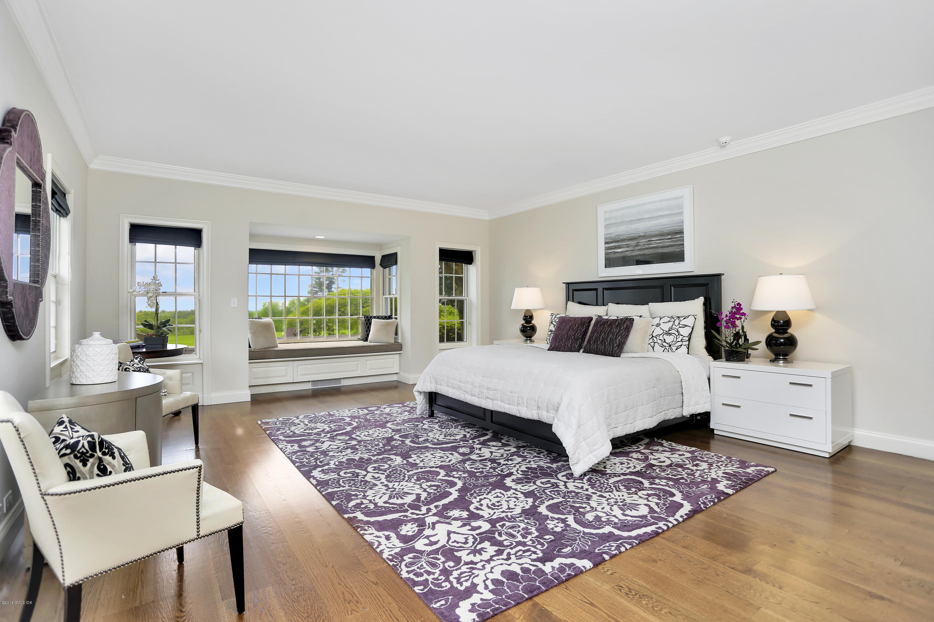 5 Dairy Road Greenwich, CT 06830 - Photo 13 of 32 a bedroom with a bed and wooden floor