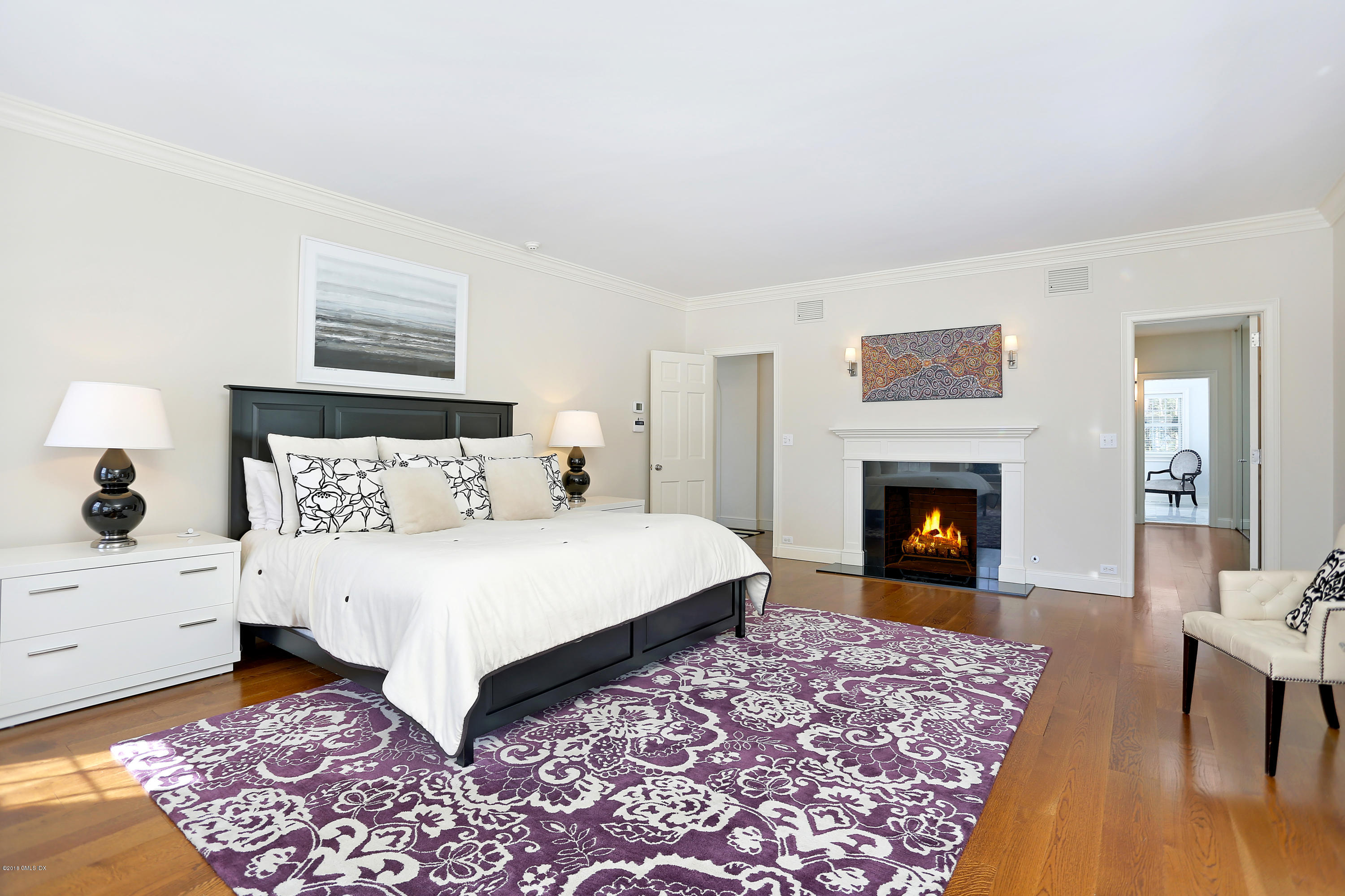 5 Dairy Road Greenwich, CT 06830 - Photo 14 of 32 a bed room with a bed and a fireplace
