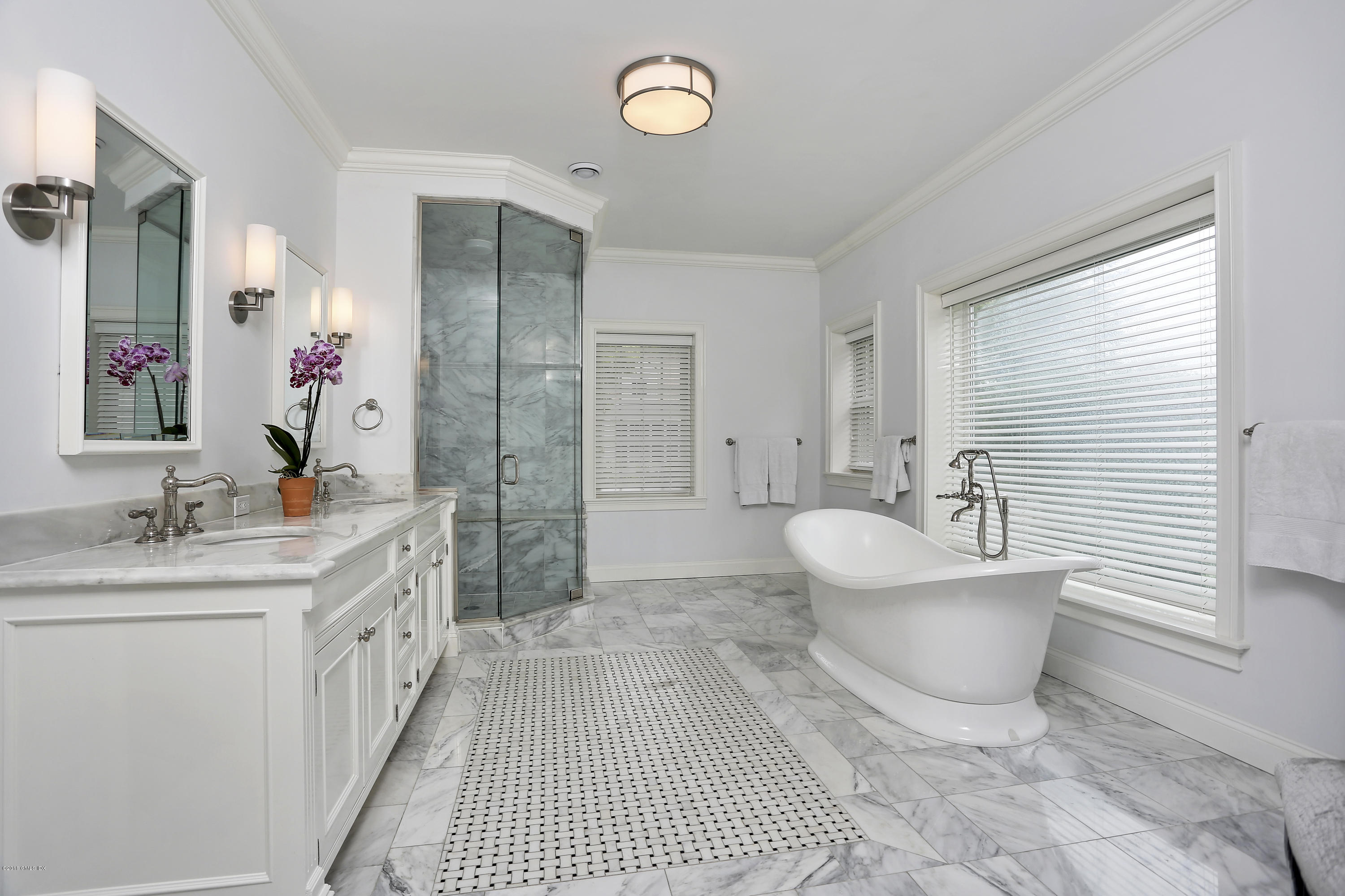 5 Dairy Road Greenwich, CT 06830 - Photo 15 of 32 a bathroom with a sink a toilet and shower