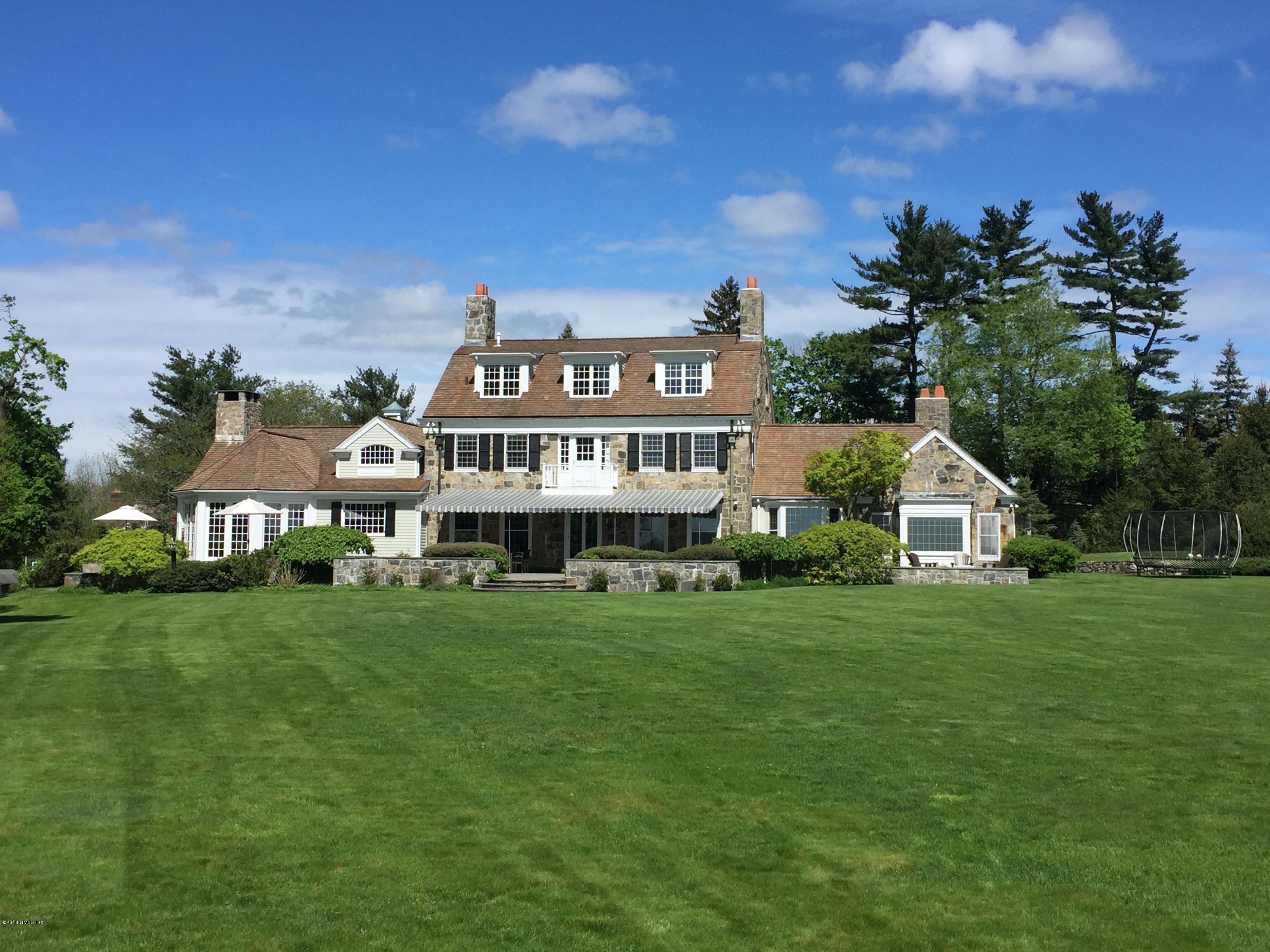 5 Dairy Road Greenwich, CT 06830 - Photo 2 of 32 a view of a big yard with plants and large trees