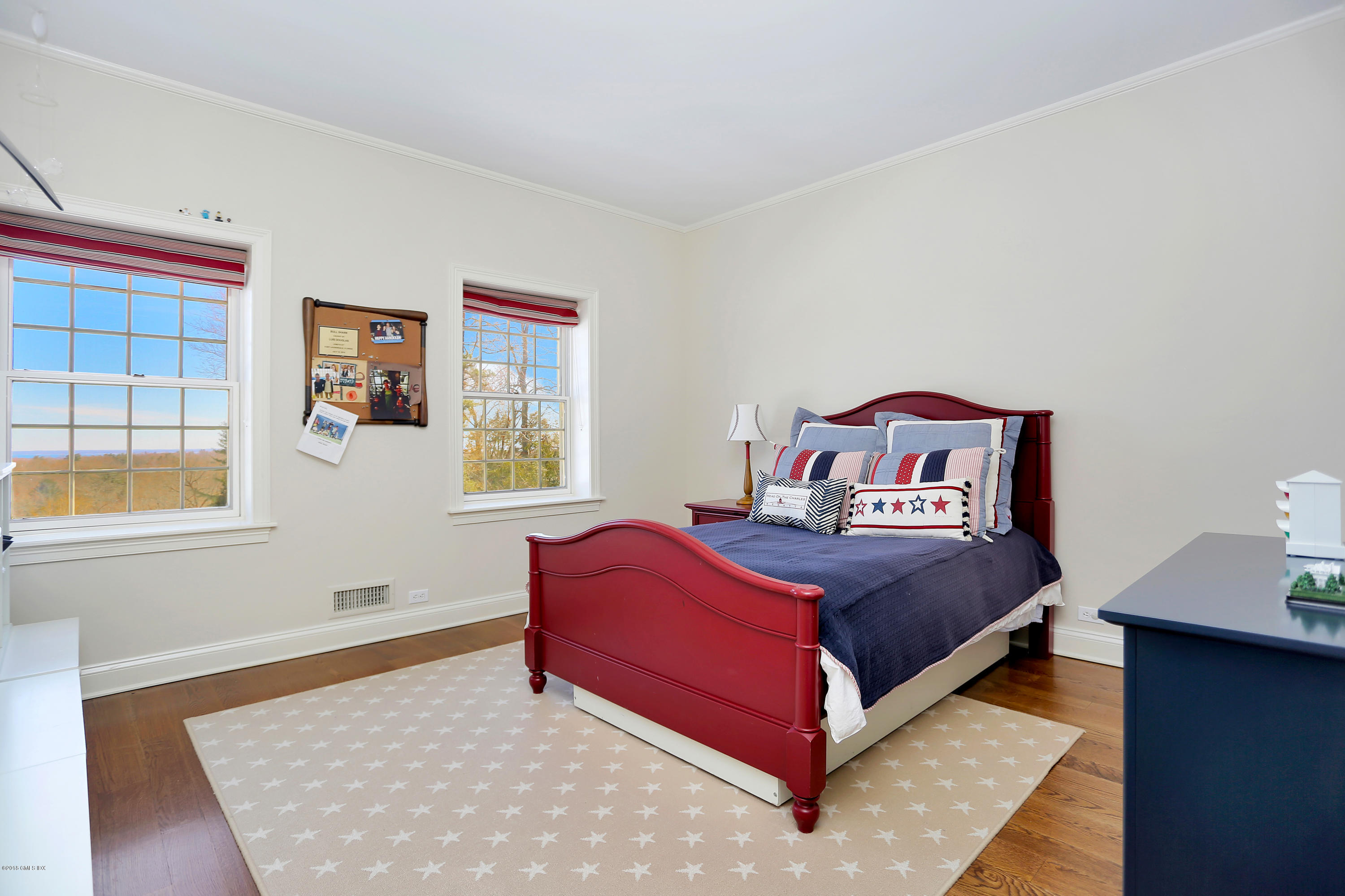 5 Dairy Road Greenwich, CT 06830 - Photo 22 of 32 a bed sitting in a bedroom next to a window