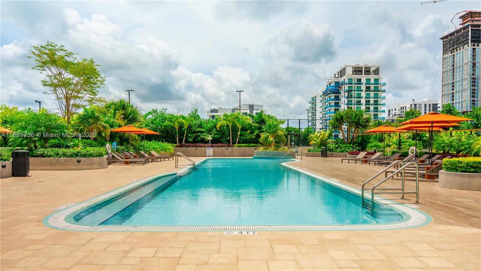 700 Northeast 24th Street, Unit 3605 Miami, FL 33137 - Photo 13 of 44 a view of a swimming pool and a yard
