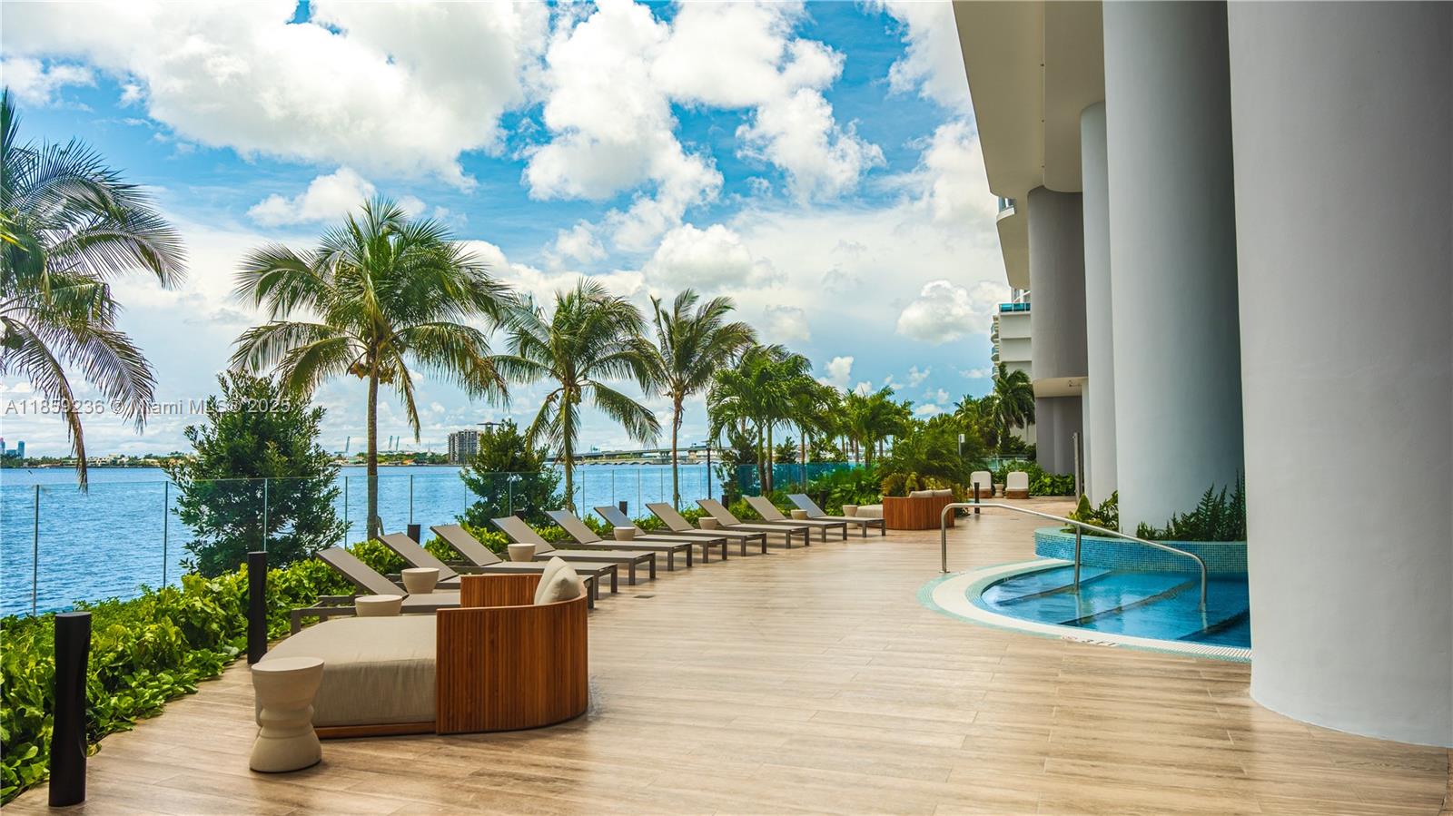 700 Northeast 24th Street, Unit 3605 Miami, FL 33137 - Photo 2 of 44 a view of a house with swimming pool and sitting area