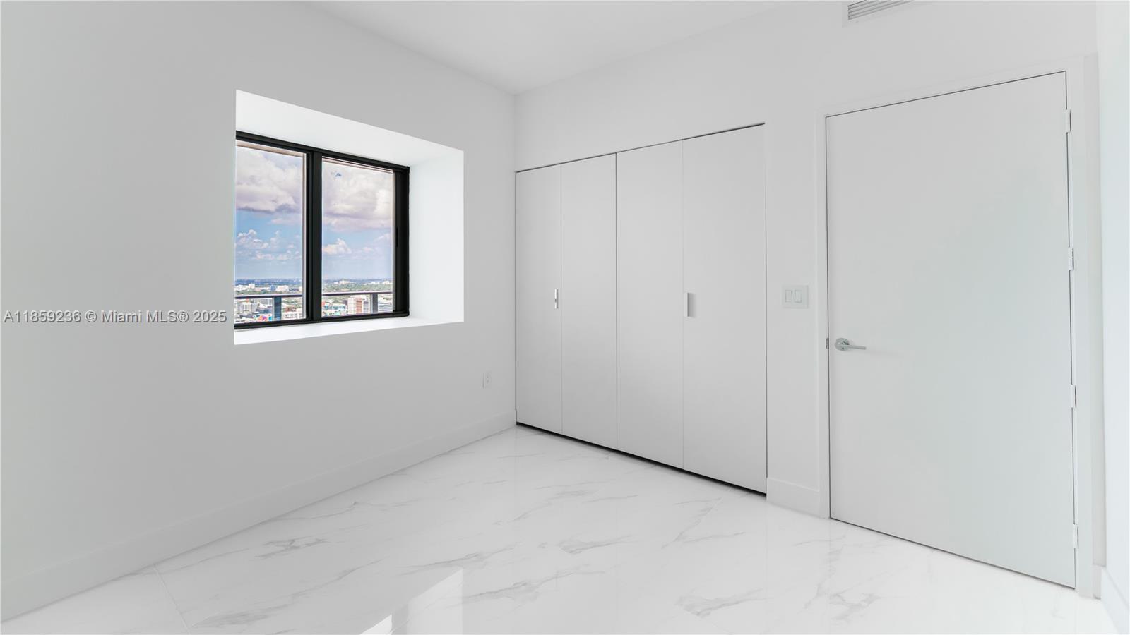 700 Northeast 24th Street, Unit 3605 Miami, FL 33137 - Photo 22 of 44 a view of an empty room with a window