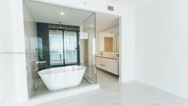 a bathroom with a bathtub and a sink