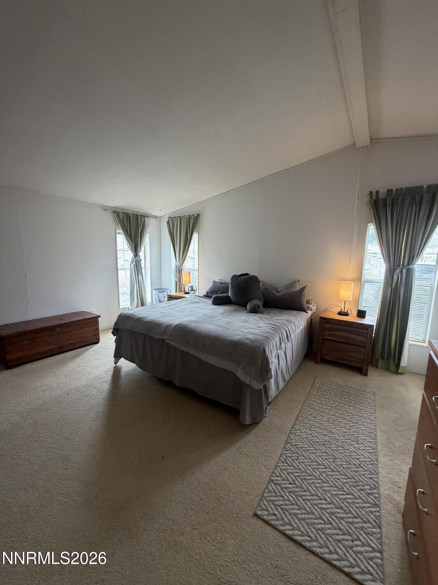 3920 Sandstone Drive Topaz Ranch Estates, NV 89444 - Photo 12 of 20 a bedroom with a bed couch and window