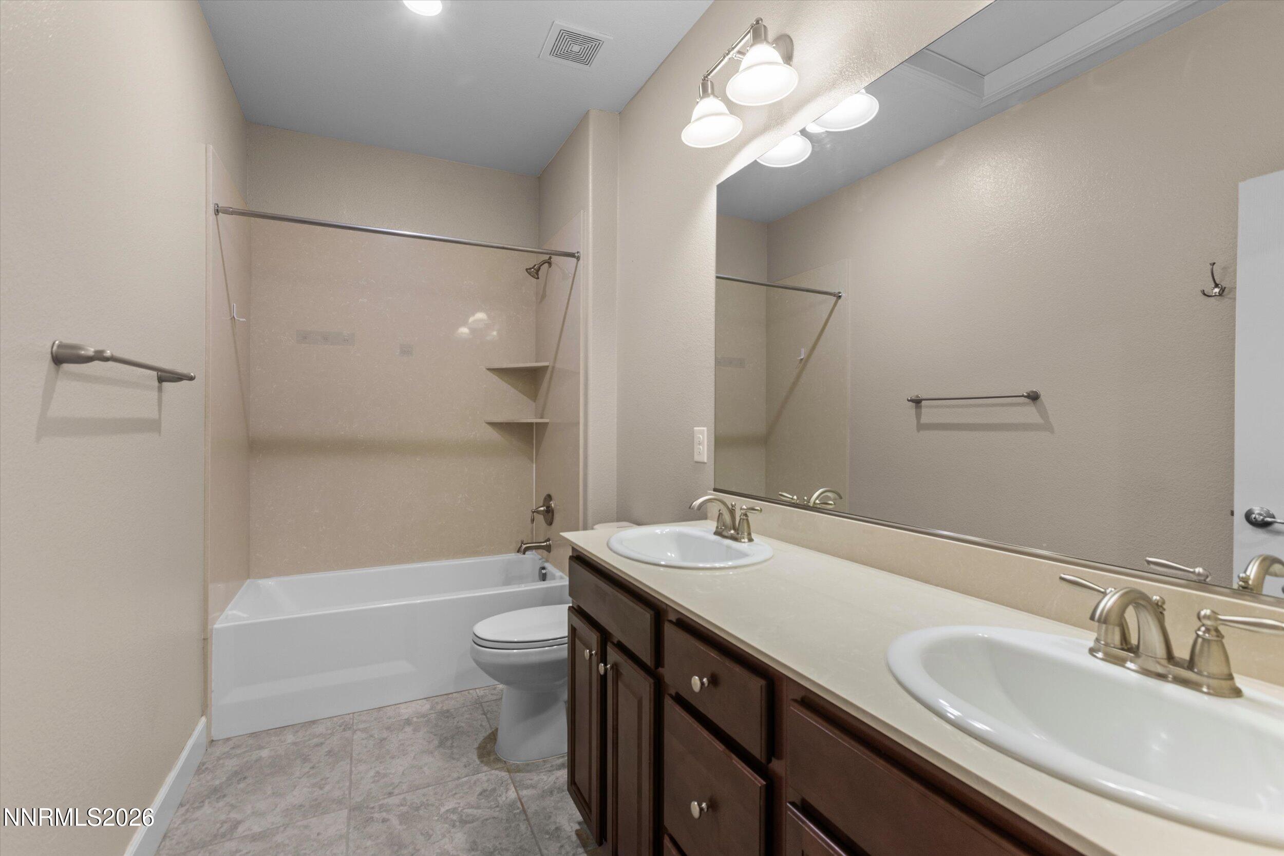 1725 Verdi Vista Court Reno, NV 89523 - Photo 23 of 37 a bathroom with a sink a toilet and shower