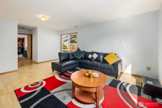 a living room with a couch and dresser