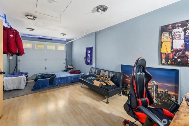 a living room with furniture gym equipment and a window