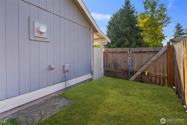a view of backyard with tub and trees