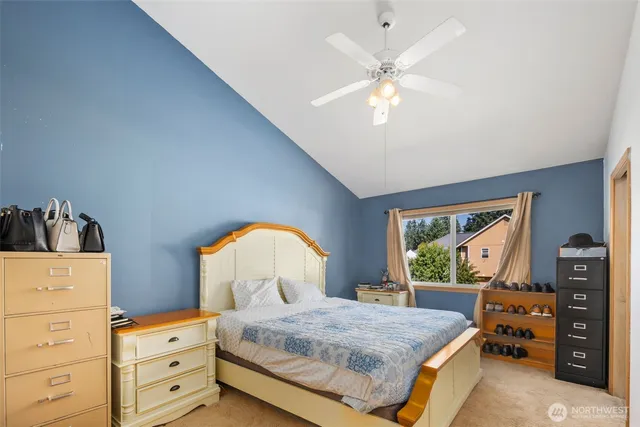 a bedroom with a bed and a dresser