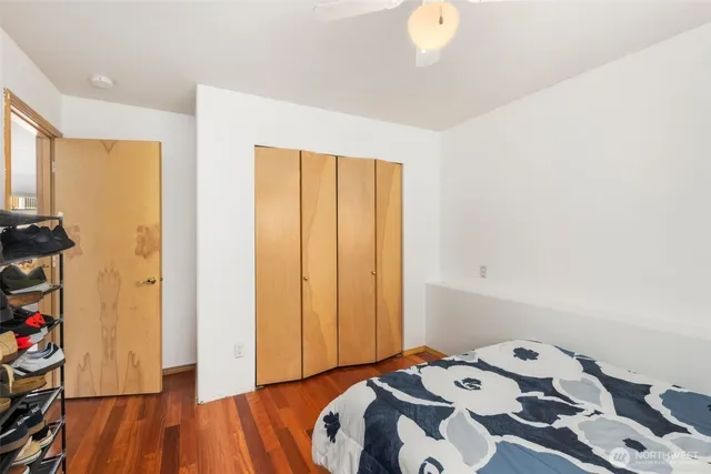 a bedroom with a bed and a closet