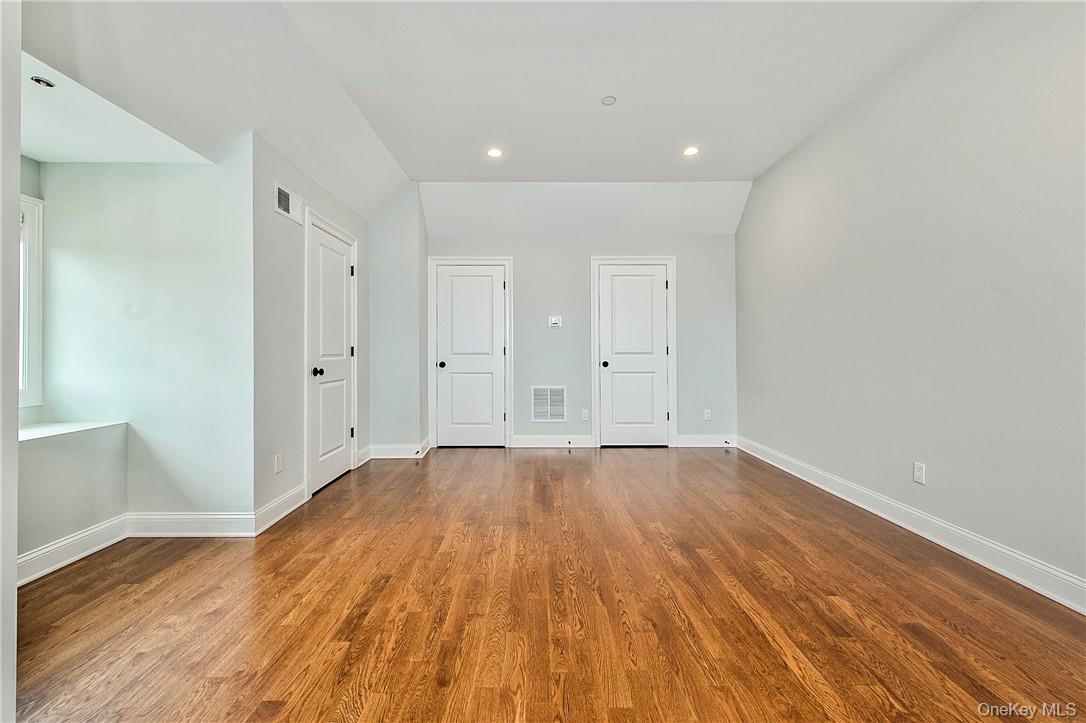 124 B Maple Avenue Rye, NY 10580 - Photo 15 of 27 a view of an empty room with wooden floor and closet