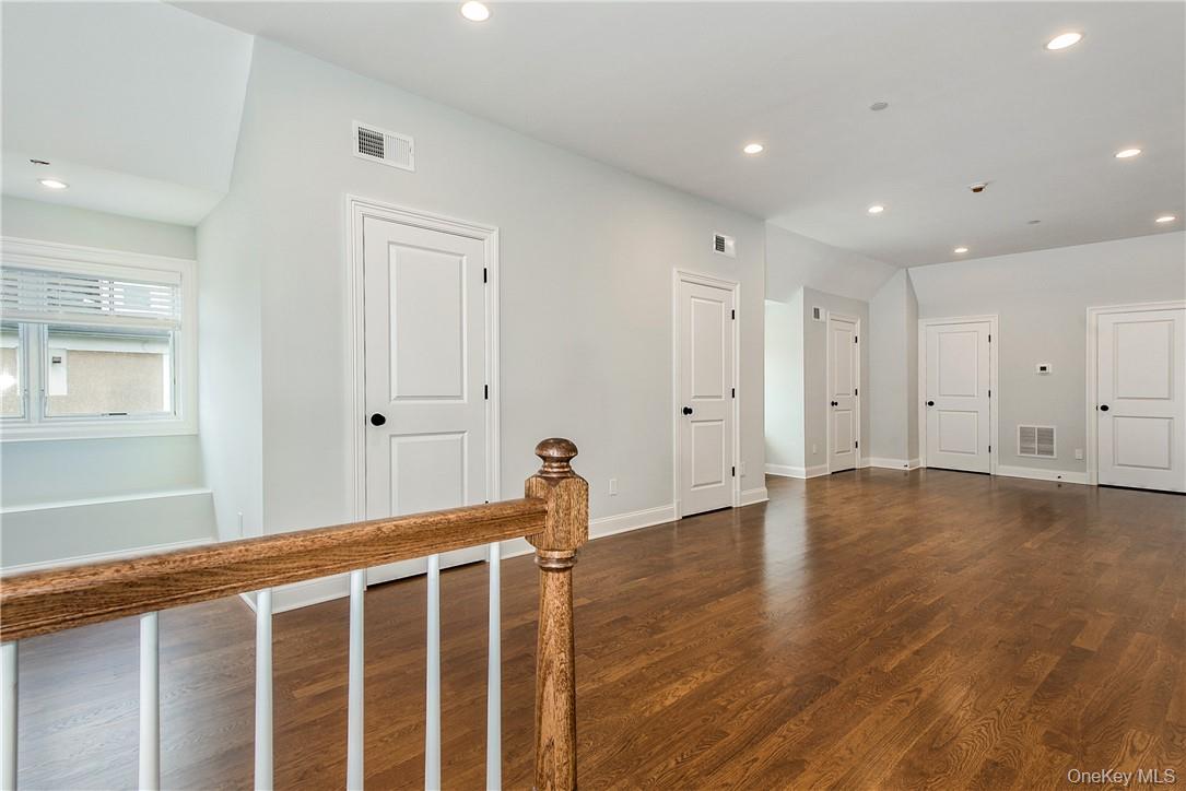 124 B Maple Avenue Rye, NY 10580 - Photo 16 of 27 a view of an empty room with wooden floor