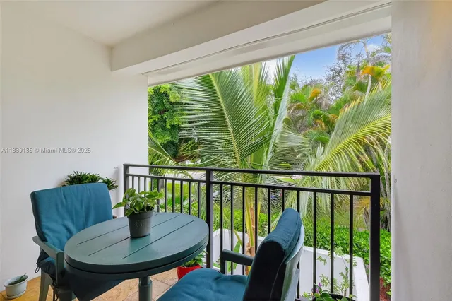 a bedroom with a bed and a view of balcony