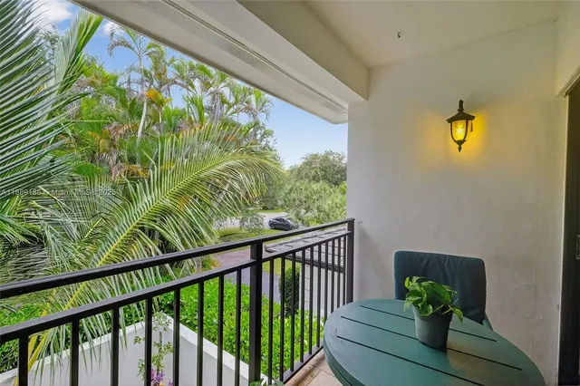 a bathroom with a sink mirror vanity and toilet