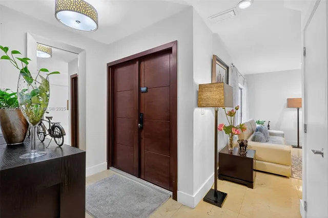 a bedroom with furniture and a potted plant