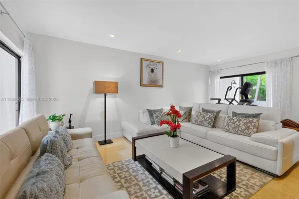 a living room with furniture and a rug