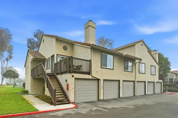 a front view of a house with garage