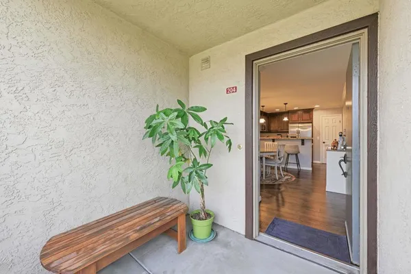 a large kitchen with a table and chairs