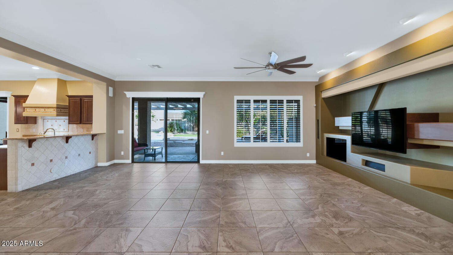 14426 West Becker Lane Surprise, AZ 85379 - Photo 11 of 68 a view of an empty room with a kitchen and a window