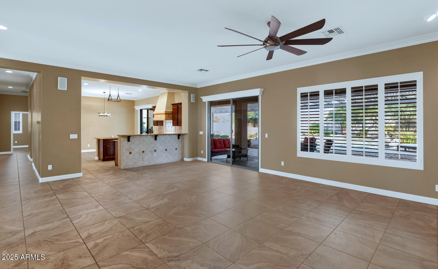 14426 West Becker Lane Surprise, AZ 85379 - Photo 14 of 68 a view of livingroom with hardwood floor and a ceiling fan
