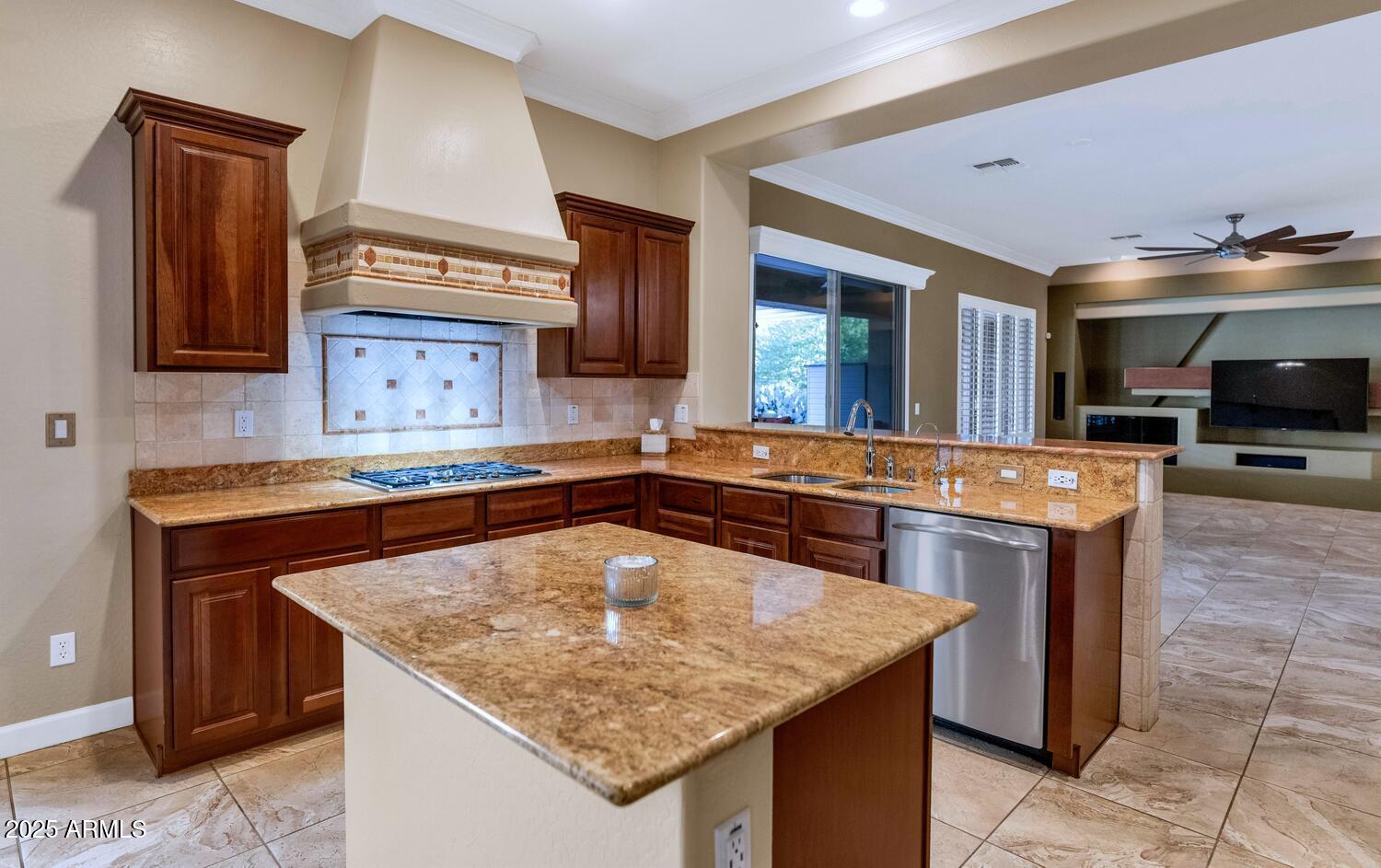 14426 West Becker Lane Surprise, AZ 85379 - Photo 16 of 68 a kitchen with granite countertop a sink and a stove