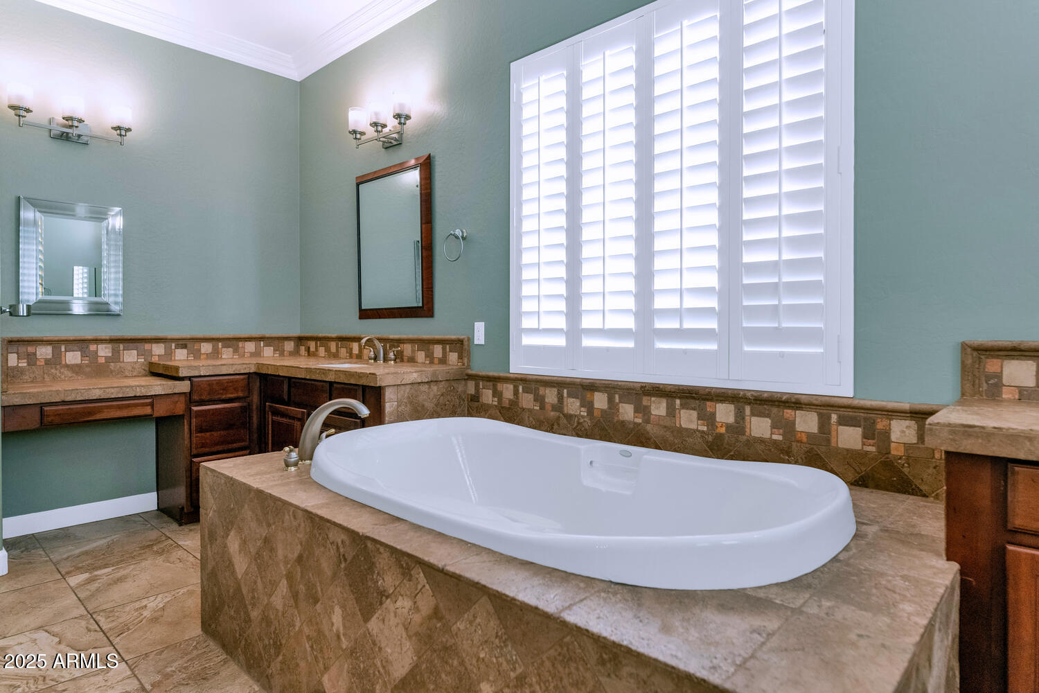 14426 West Becker Lane Surprise, AZ 85379 - Photo 27 of 68 a bath tub sitting in a bathroom next to a window
