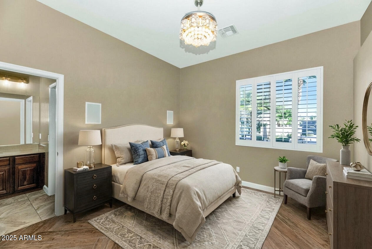 14426 West Becker Lane Surprise, AZ 85379 - Photo 33 of 68 a bedroom with bed and a window