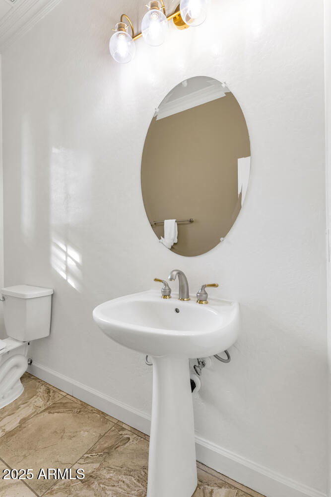 14426 West Becker Lane Surprise, AZ 85379 - Photo 35 of 68 a bathroom with a sink and mirror