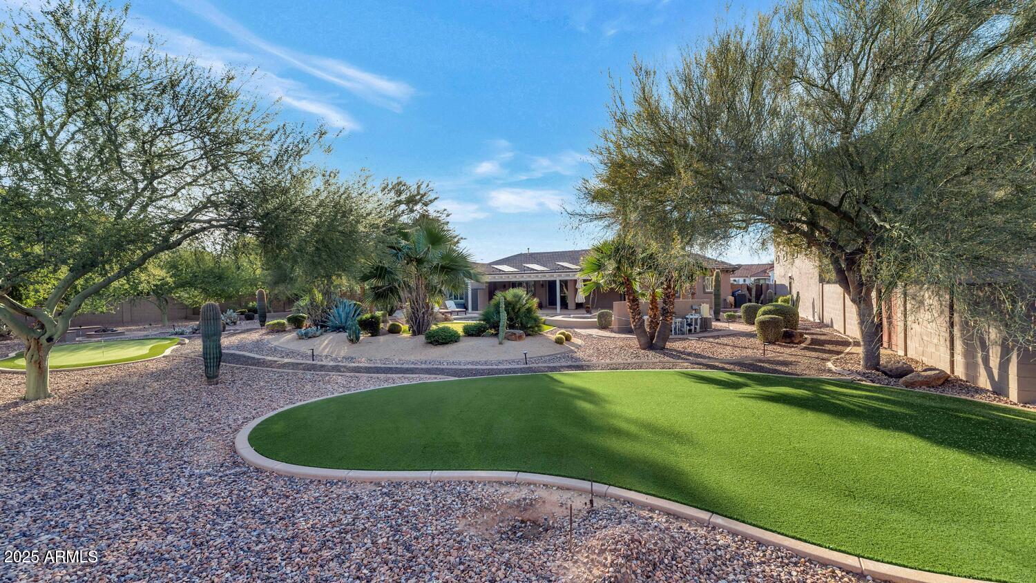14426 West Becker Lane Surprise, AZ 85379 - Photo 48 of 68 a view of a house with swimming pool and sitting area