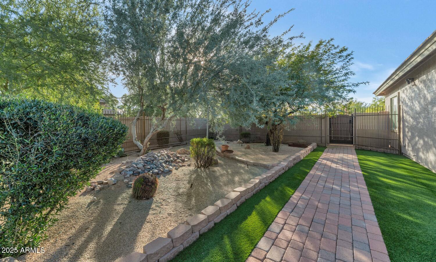 14426 West Becker Lane Surprise, AZ 85379 - Photo 49 of 68 a view of a backyard with green space