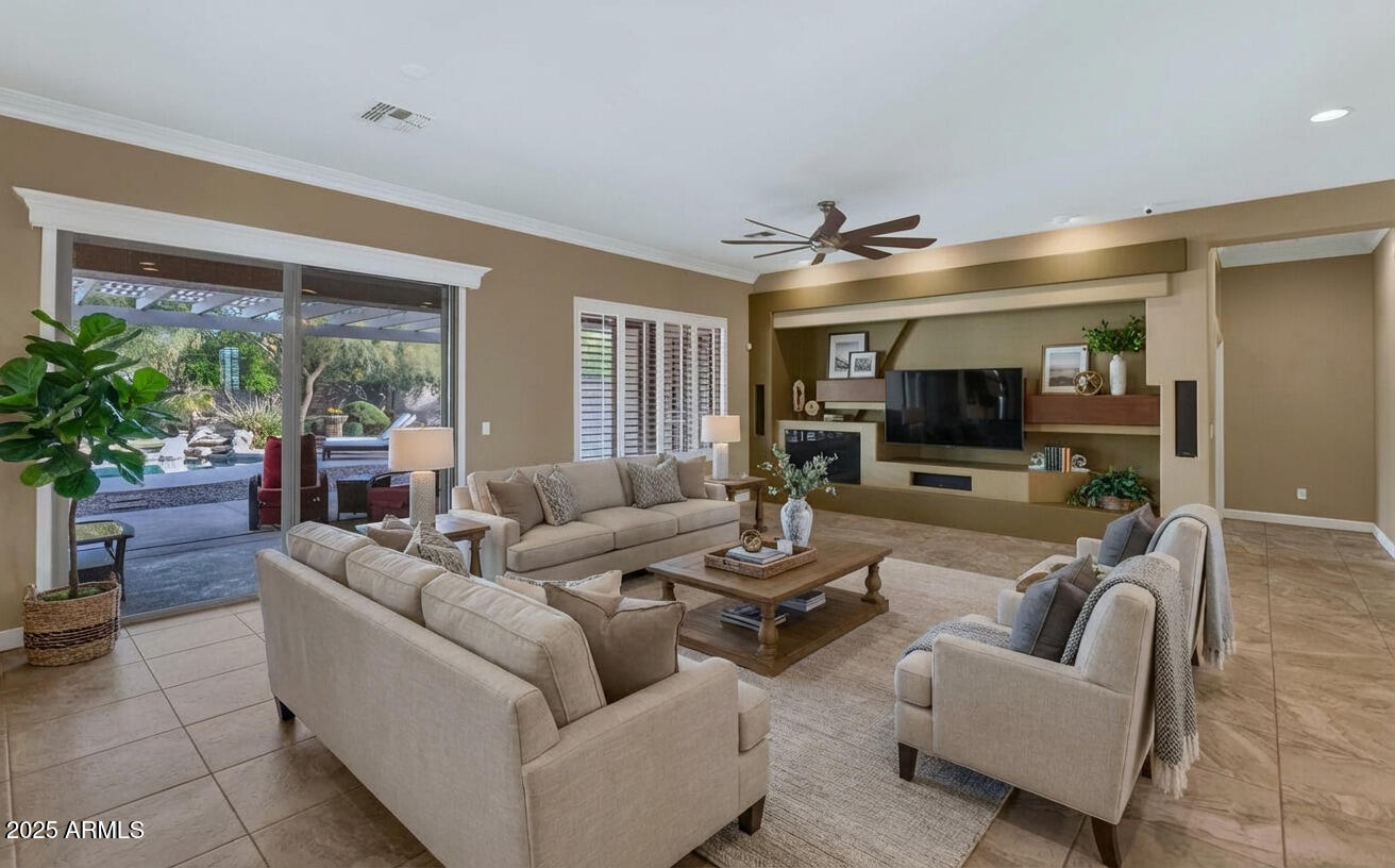 14426 West Becker Lane Surprise, AZ 85379 - Photo 4 of 68 a living room with furniture and a flat screen tv