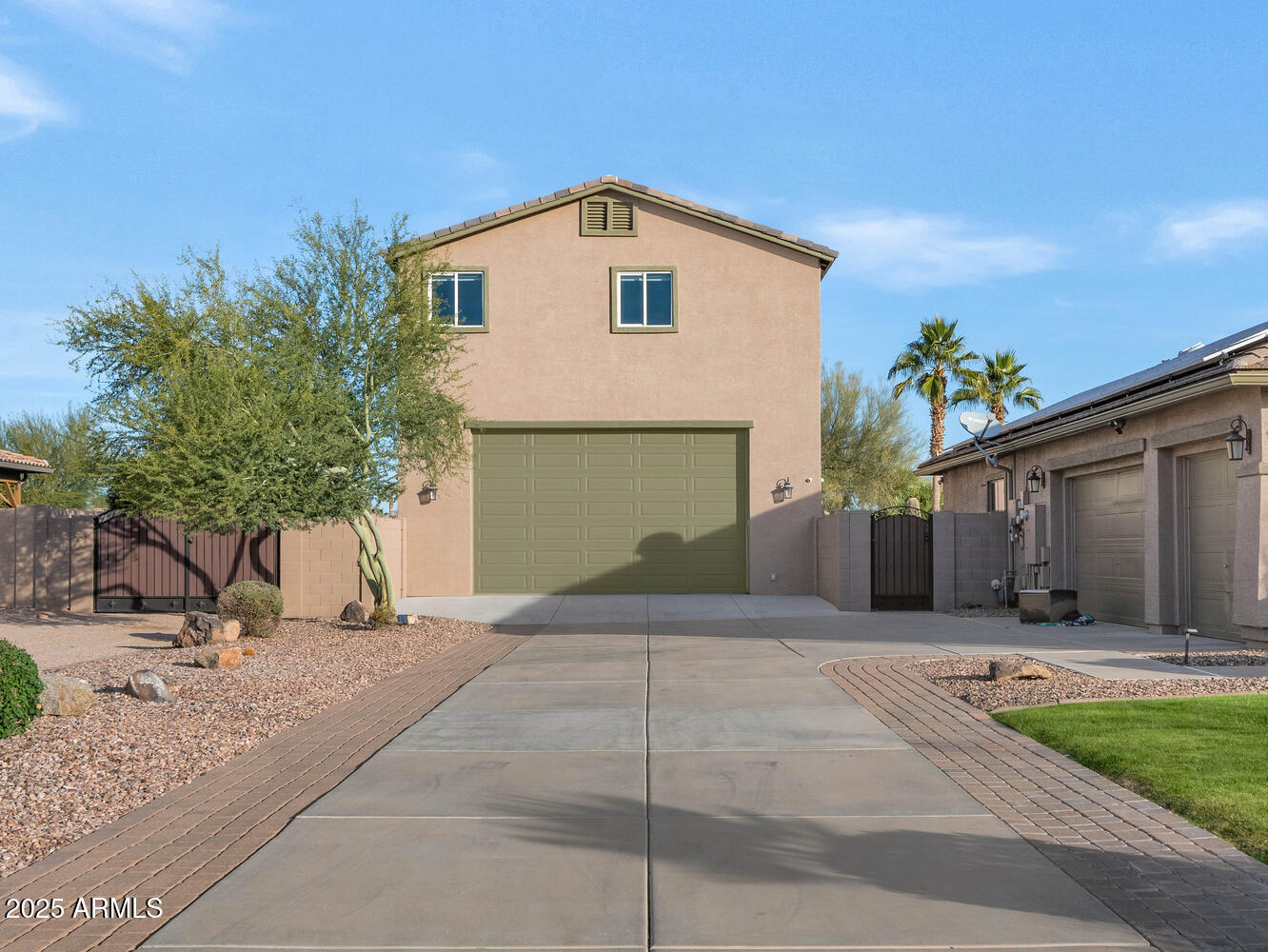 14426 West Becker Lane Surprise, AZ 85379 - Photo 50 of 68 a front view of a house with a yard and garage