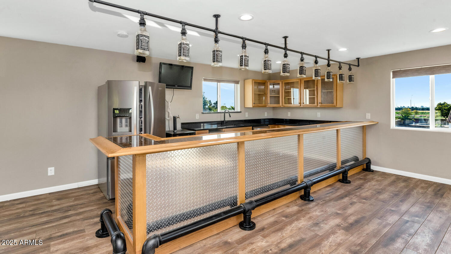 14426 West Becker Lane Surprise, AZ 85379 - Photo 56 of 68 a kitchen with stainless steel appliances granite countertop a stove a sink and a refrigerator
