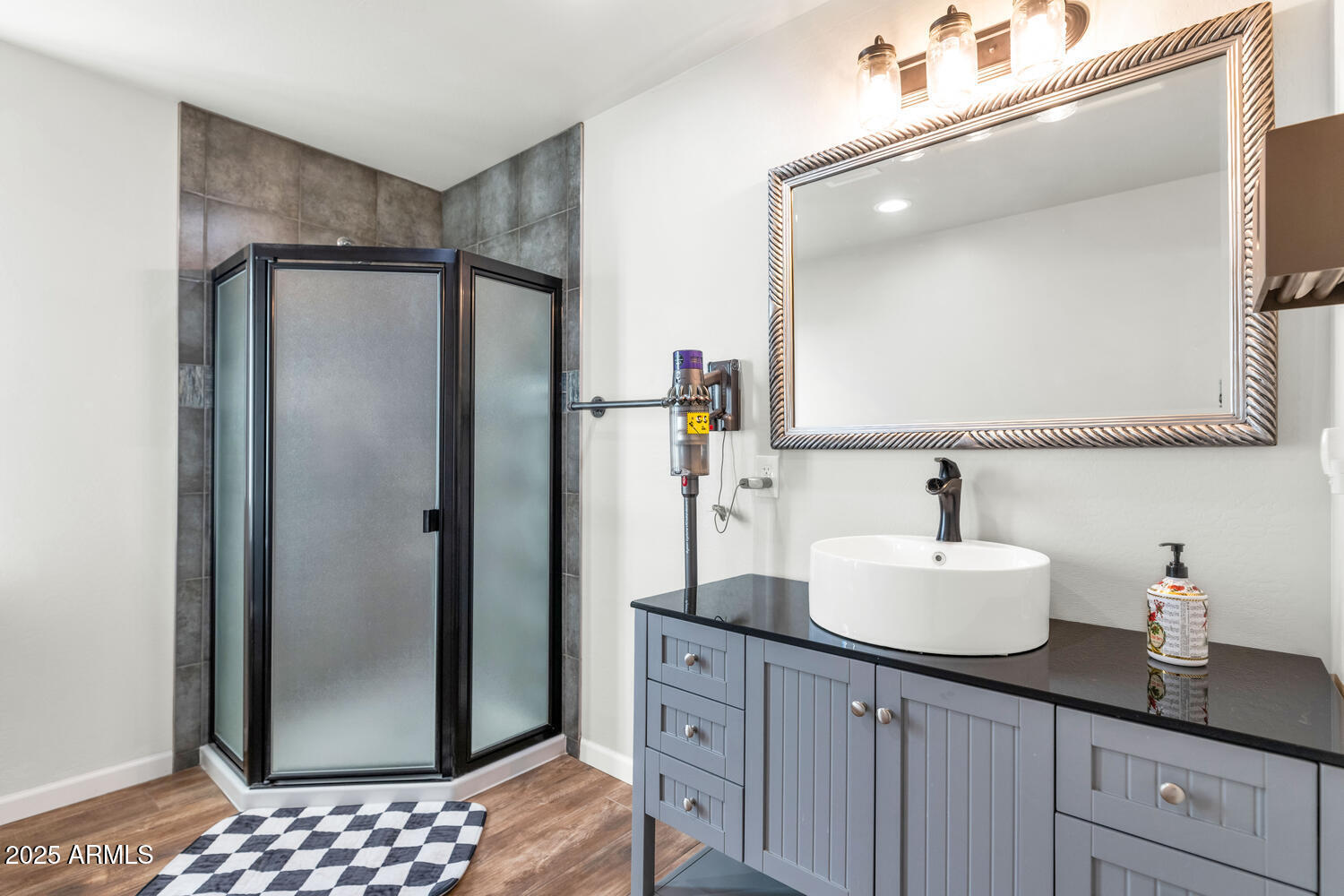 14426 West Becker Lane Surprise, AZ 85379 - Photo 58 of 68 a bathroom with a sink and a mirror