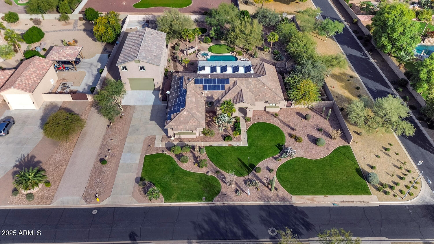 14426 West Becker Lane Surprise, AZ 85379 - Photo 61 of 68 an aerial view of a house with garden space and street view