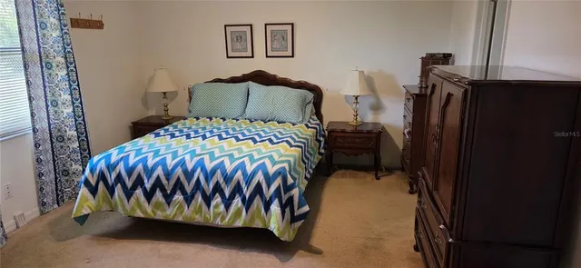 a bedroom with a bed and a walk in closet