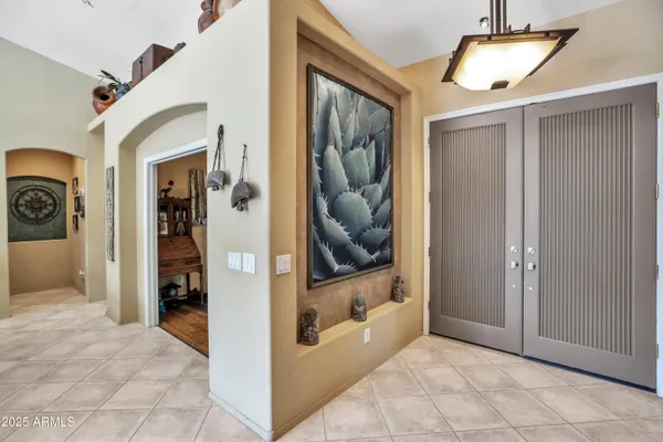 a view of a hallway with wooden shelves
