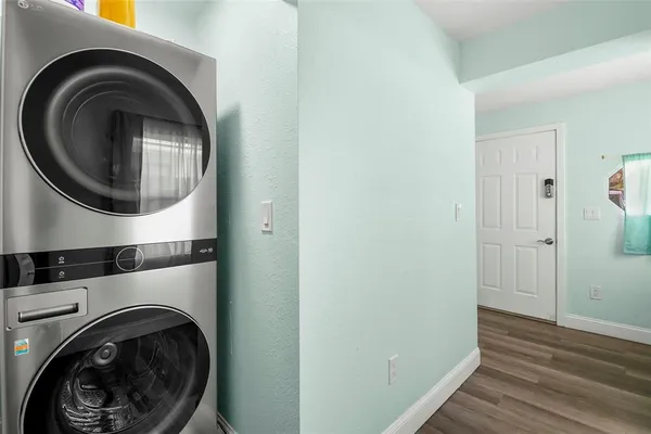 a view of a hallway with washer and dryer