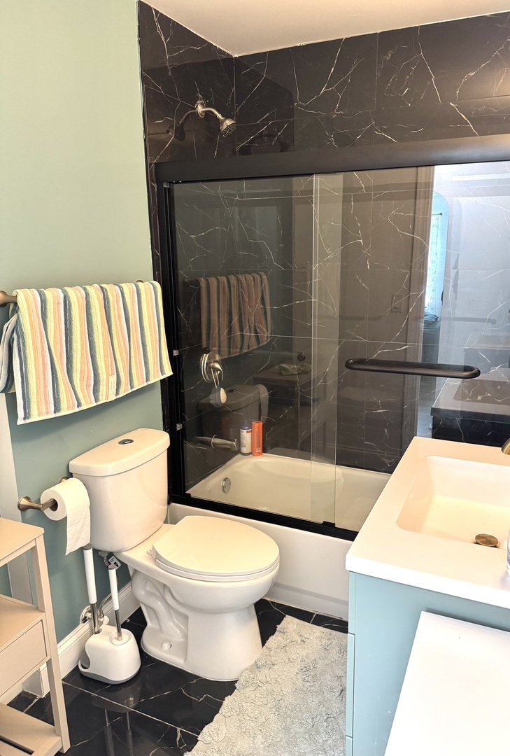 931 South Rawson Bridge Road Cary, IL 60013 - Photo 13 of 36 a bathroom with a sink and a toilet