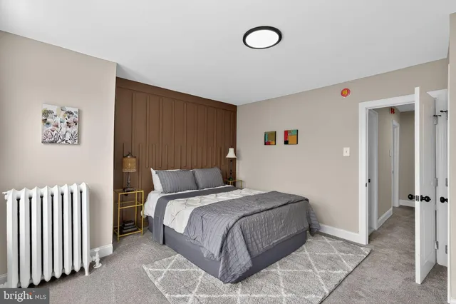 a bedroom with a bed and a cabinets