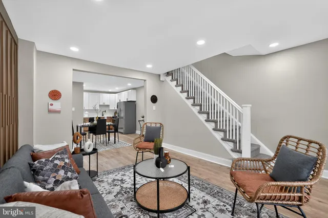 a living room with furniture and gym equipment