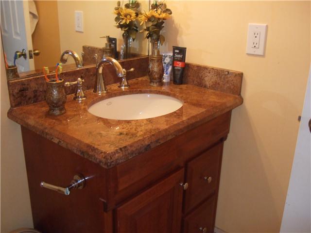9309 Gettysburg Road Boca Raton, FL 33434 - Photo 9 of 17 a bathroom with a sink and a mirror